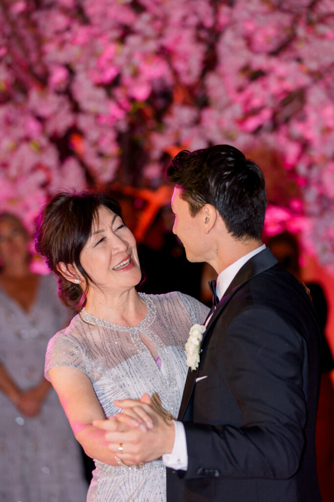 Mother and son dance in the Rotunda room at the Bacara