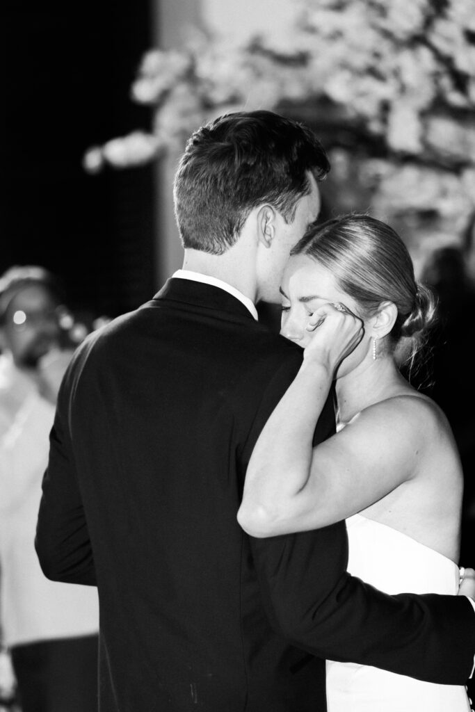 Bride and groom share happy tears at the Bacara during their first dance 