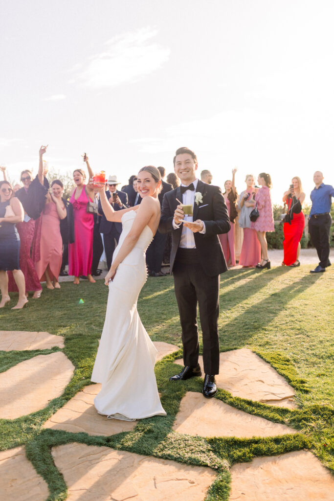 Bride and groom join their cocktail hour on the bluffs at the Bacara Santa Barbara