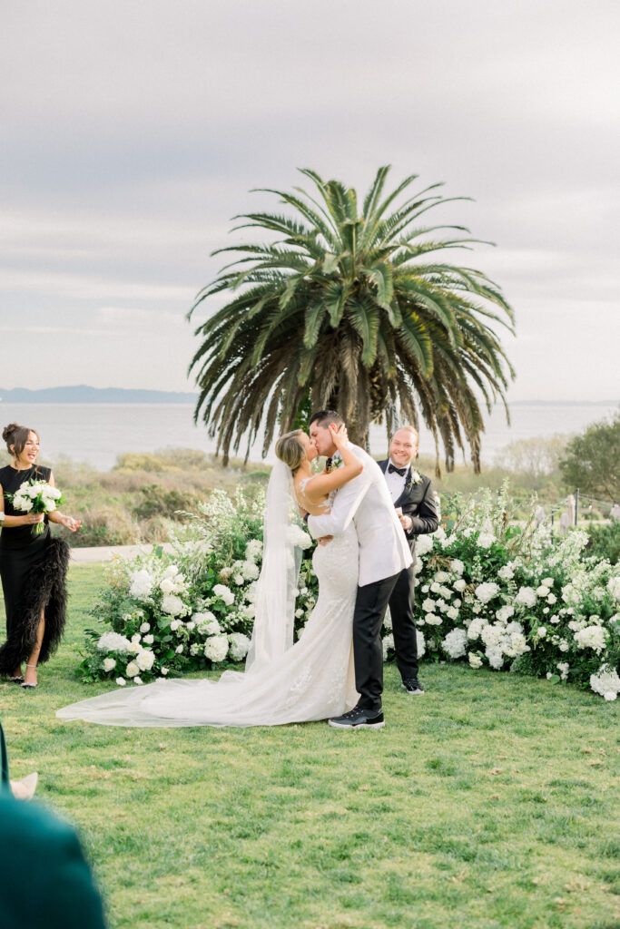 Bride and grooms first kiss at the Bacara