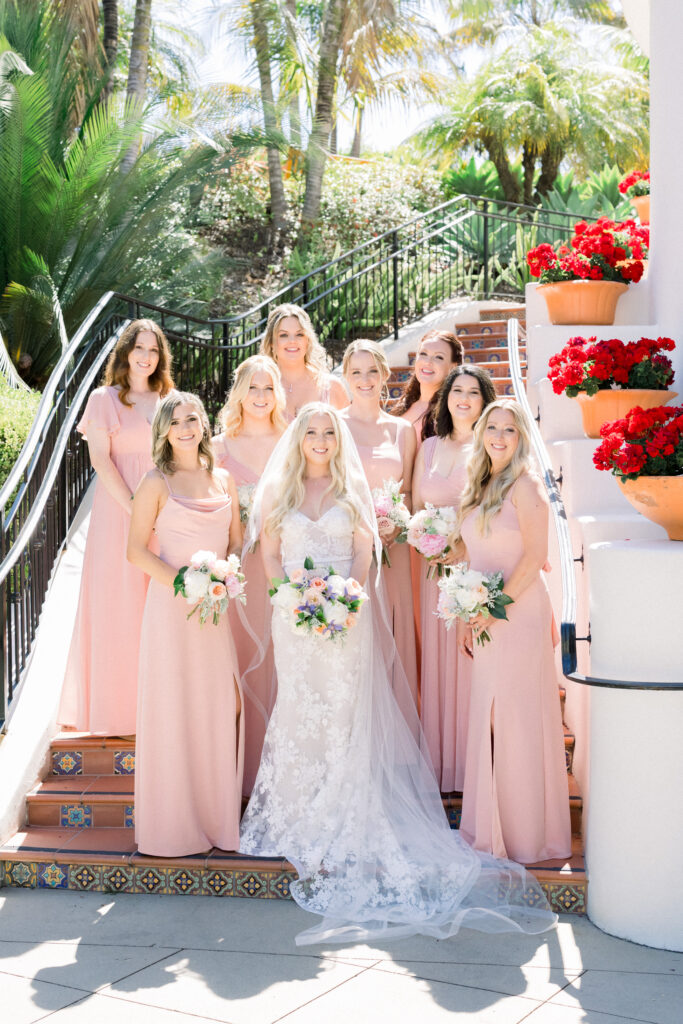 Bride and her bridesmaids on the stairs the the Bacara