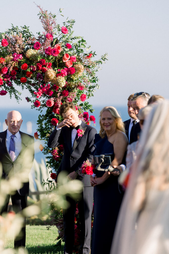 Grooms sheds a tear as he sees is bride at the Bacara